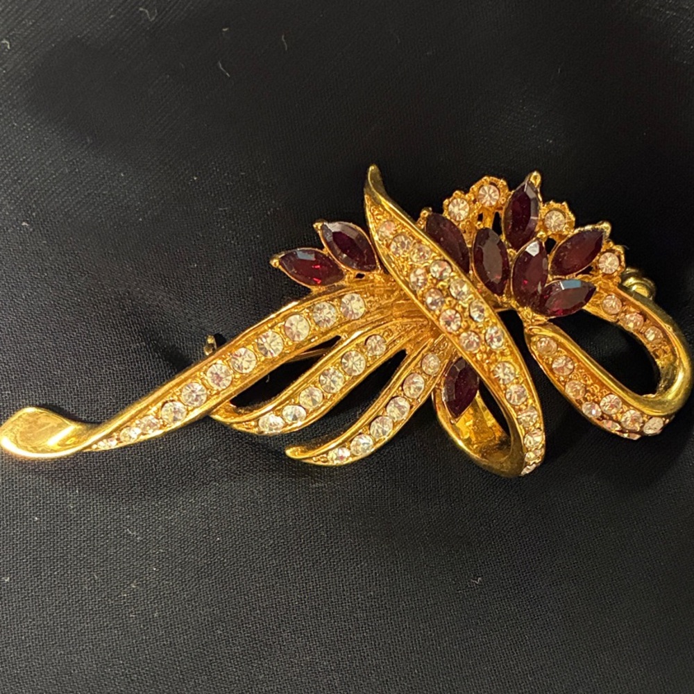 Gold-Tone Floral Ribbon Brooch with Burgundy Crystals